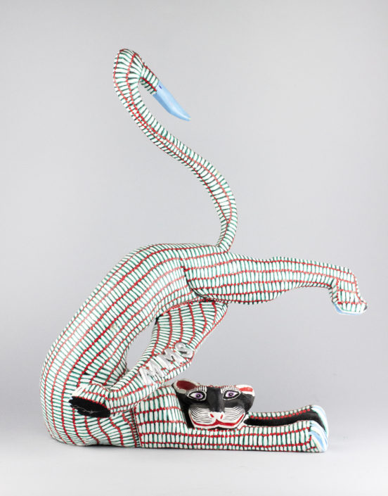 Margarito Melchor and Maria Teresa Santiago, Red and White Striped Cat, 1989 wood, 9 x 14.5 x 22 in Collection of the Tucson Museum of Art. Gift of Shepard Barbash and Vicki Ragan. 2018.22.330 Margarito Melchor and Maria Teresa Santiago, Red and White Striped Cat, 1989 wood, 9 x 14.5 x 22 in Collection of the Tucson Museum of Art. Gift of Shepard Barbash and Vicki Ragan. 2018.22.330